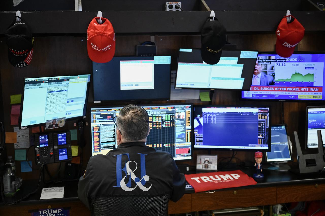 A trader works on the floor of the New York Stock Exchange (NYSE) at the opening bell in New York City, on June 13, 2025. (AFP Photo)