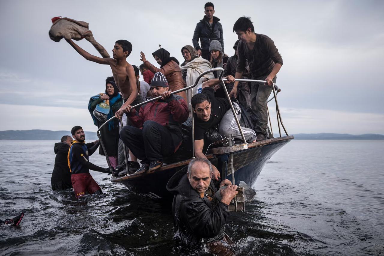 Refugees arrive to the Greek island of Lesbos after crossing the Aegean sea in October 2015, captured by Pulitzer Prize-winning photographer Sergey Ponomarev, now exhibited in Rotterdam's Fenix Museum of Migration, Netherlands, May 14, 2025. (Photo by Selin Hacialioglu/Türkiye Today) 
