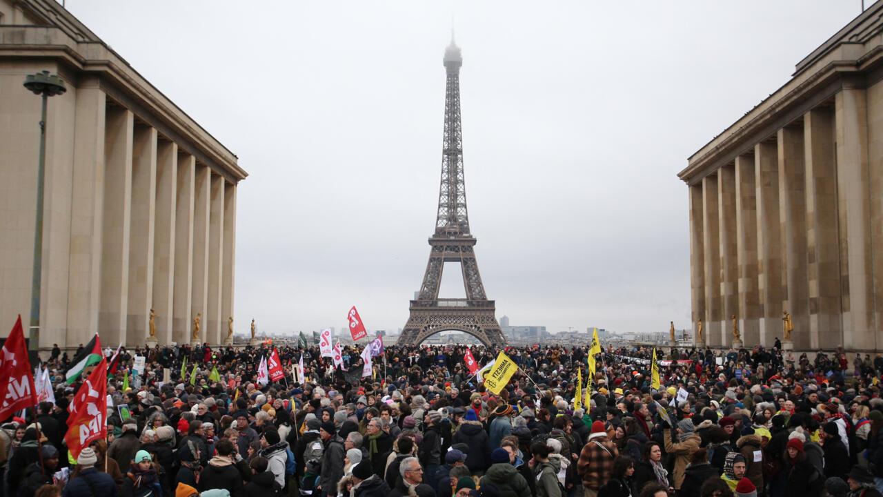 Protesters take part in a rally against France's recently adopted law on immigration at Place du Trocadero, with the Eiffel Tower in the background, in Paris, France, Jan. 21, 2024. (AFP Photo)