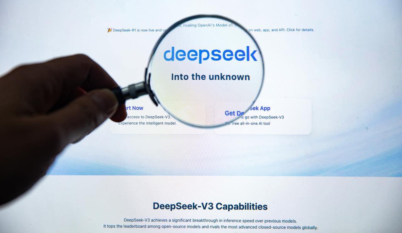 File photo shows a close-up of a person interacting with a screen displaying the logo of Chinese AI firm DeepSeek and its slogan,  Into the unknown. . (Adobe Stock Photo)