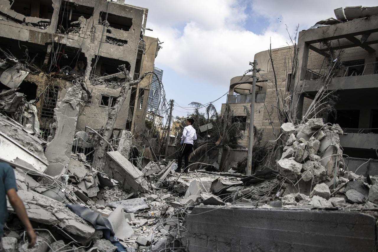 An Ultra-Orthodox Jewish man inspects the damage at the site of an Iranian missile strike in Bnei Brak, east of Tel Aviv, on June 16, 2025. (AFP Photo)