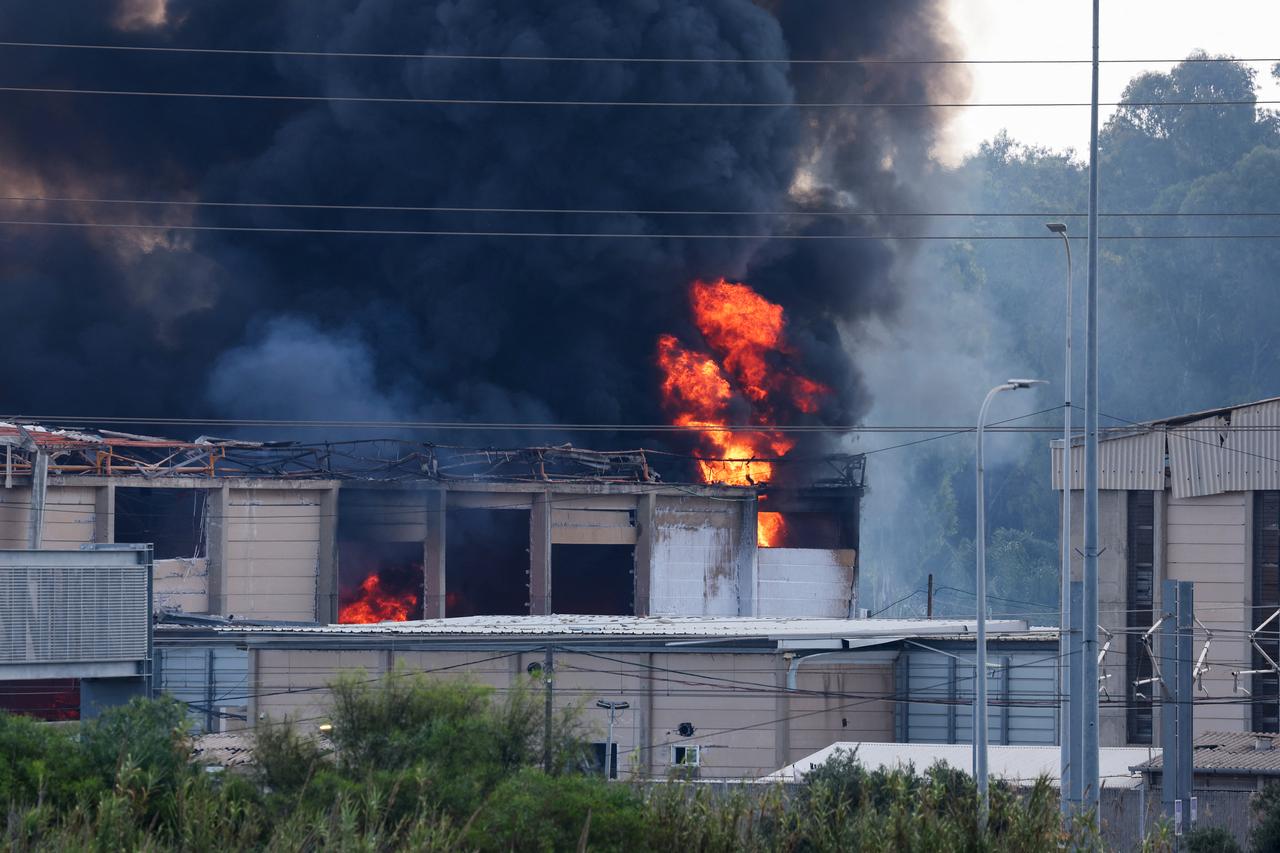 Smoke billows from a fire in a building in Herzliya near Tel Aviv following a fresh barrage of Iranian rockets on June 17, 2025. (AFP Photo)