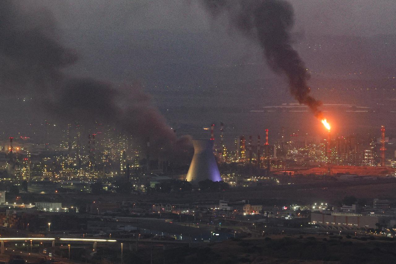 Smoke billows from a site in the city of Haifa on June 16, 2025, following a fresh barrage of Iranian missiles. (AFP Photo)