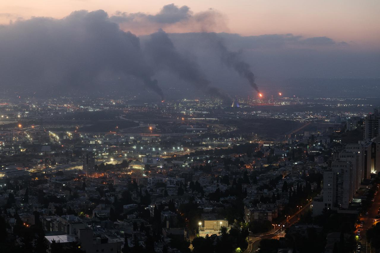 Smoke billows from a site in the city of Haifa on June 16, 2025, following a fresh barrage of Iranian missiles. (AFP Photo)