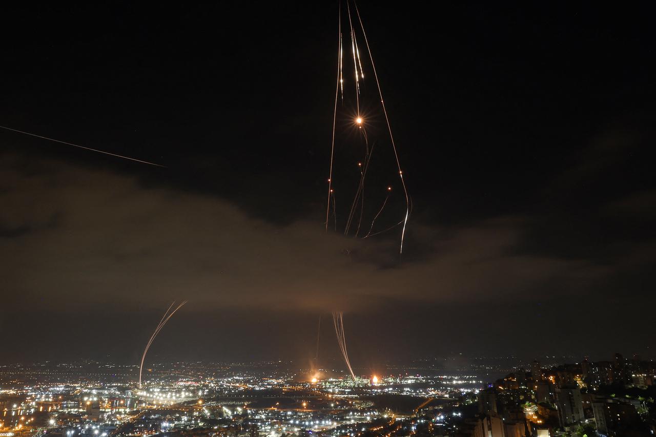 Israeli air defence systems are activated to intercept Iranian missiles over the Israeli city of Haifa amid a fresh barrage of Iranian rockets on June 16, 2025. (AFP Photo)