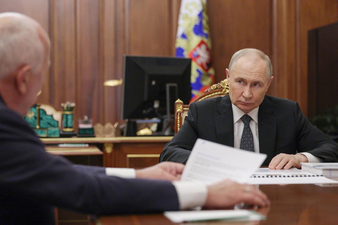 In this pool photograph distributed by Russian state agency Sputnik, Russias President Vladimir Putin (R) attends a meeting with Russias state-owned defence corporation Rostec CEO Sergei Chemezov in Moscow on June 17, 2025. (Photo by Gavriil GRIGOROV / POOL / AFP)