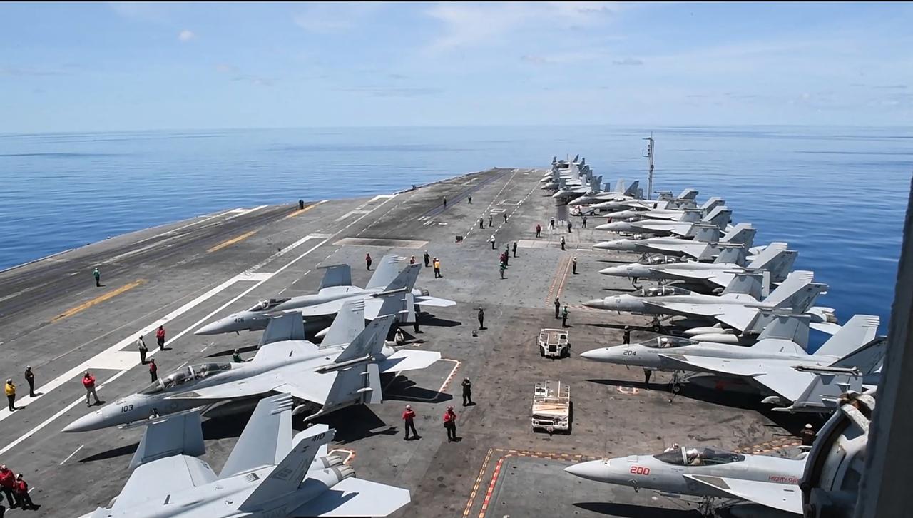 This handout grab taken from footage released by the US Defence Visual Information Distribution Service (DVIDS) on June 11, 2025 shows the aircraft carrier USS Nimitz (CVN 68) conducting flight operations in the South China Sea, on May 28, 2025. The aircraft carrier USS Nimitz was leaving Southeast Asia on June 16, 2025 after cancelling plans to dock in Vietnam, amid reports it is headed to the Middle East to boost the US presence as Israel and Iran do battle. (Photo by Edward Jacome / DVIDS / AFP) / RESTRICTED TO EDITORIAL USE - MANDATORY CREDIT  AFP PHOTO /  DVIDS / MASS COMMUNICATION SPECIALIST SEAMAN EDWARD JACOME  - HANDOUT - NO MARKETING NO ADVERTISING CAMPAIGNS - DISTRIBUTED AS A SERVICE TO CLIENTS