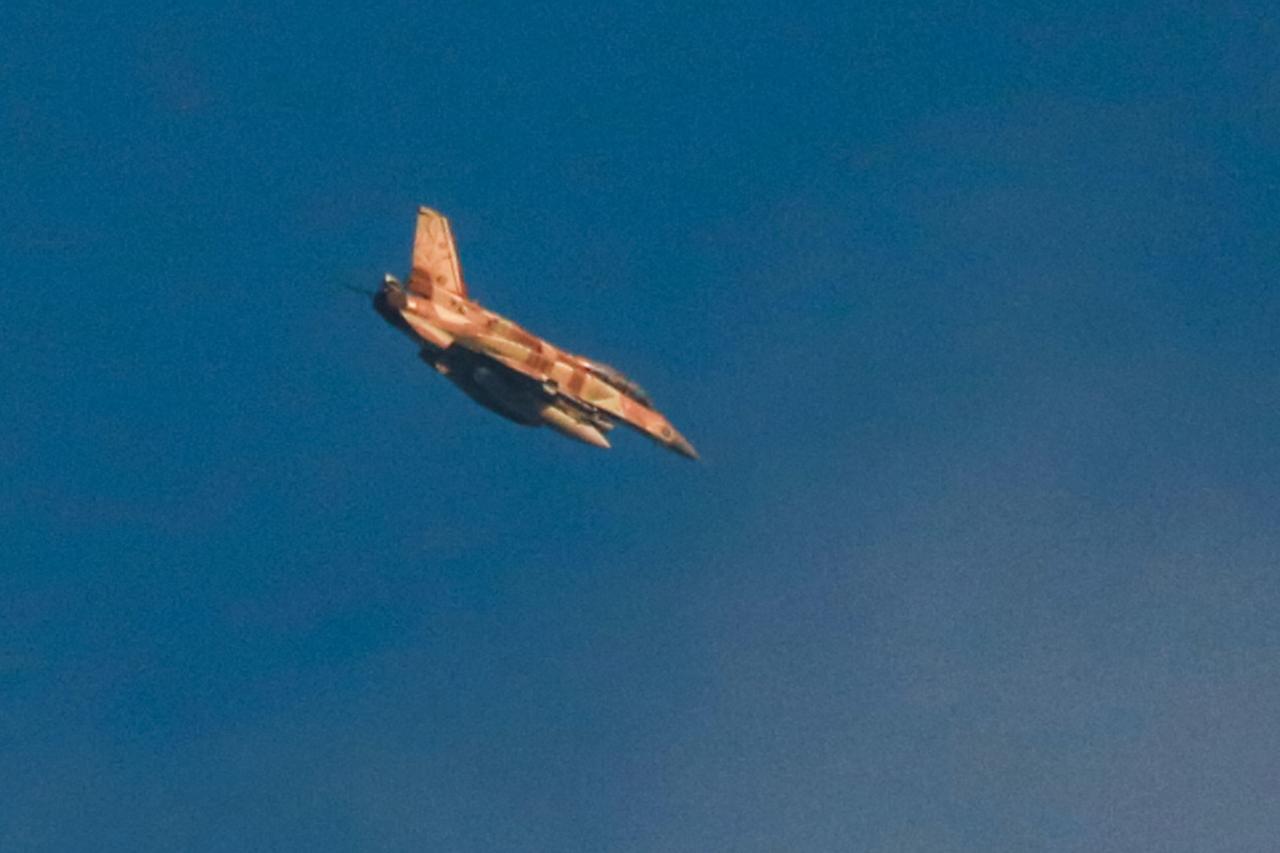An Israeli F-16 fighter aircraft flies over Jabalia in the northern Gaza Strip on June 17, 2025. (AFP Photo)
