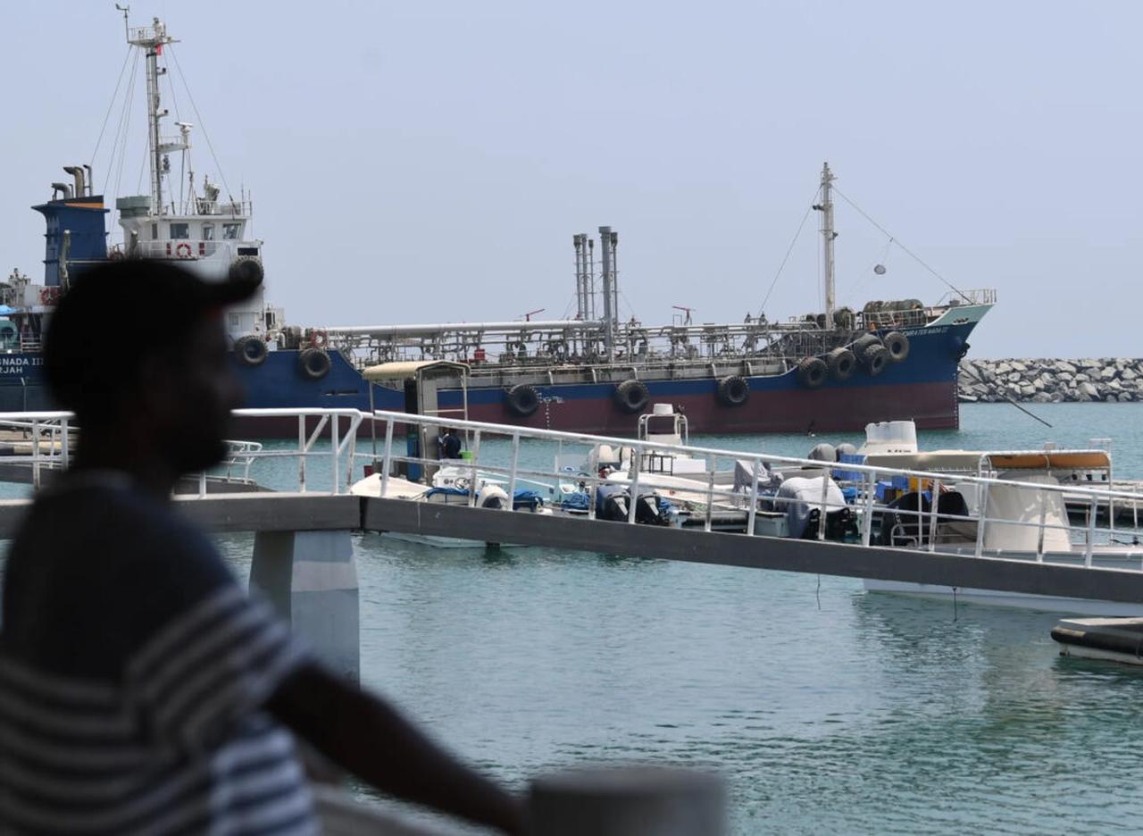 A man watches ships in the port of Fujairah in the east of the United Arab Emirates, accessed on 18 June, 2025. (AFP Photo)