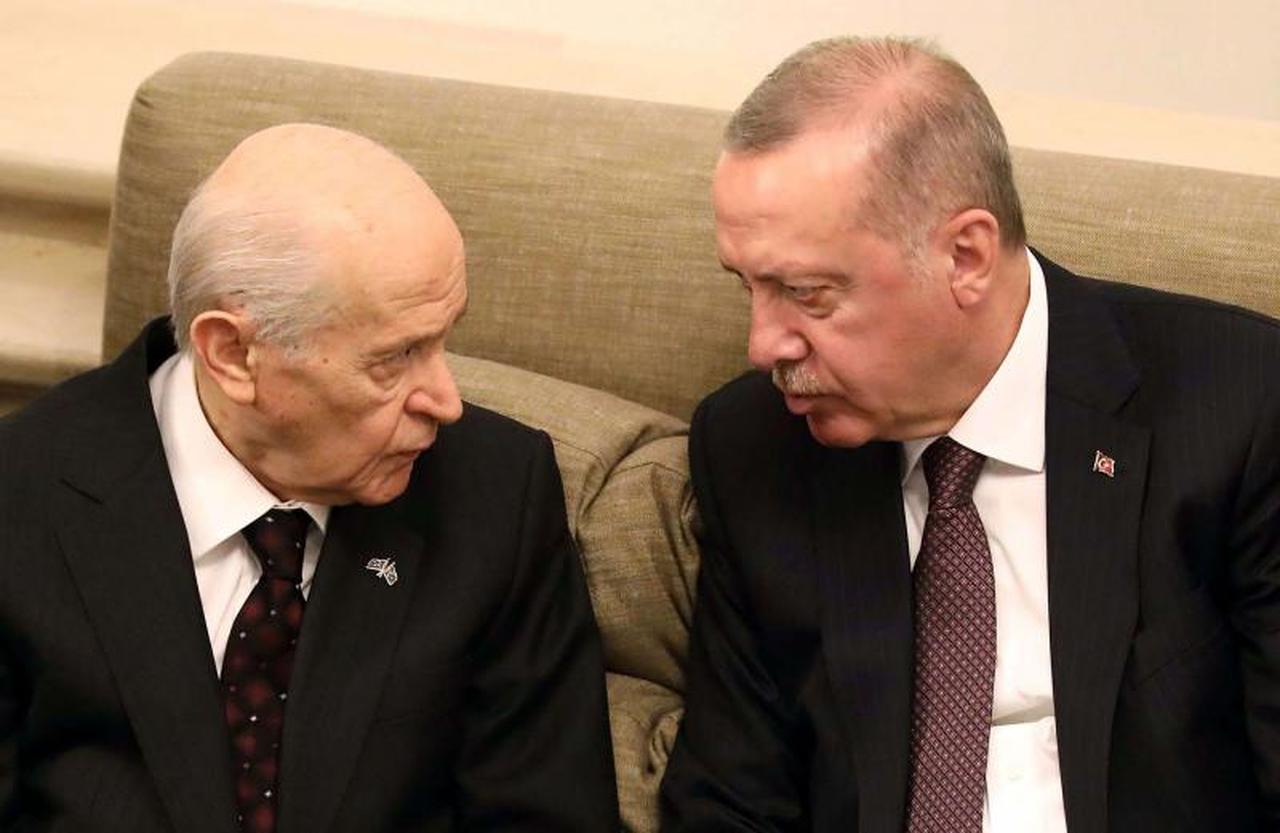 A file picture shows Turkish President Recep Tayyip Erdogan (R) talking to Turkey’s Nationalist Movement Party’s (MHP) Leader, Devlet Bahceli at the Turkish Grand National Assembly in Ankara. (AFP Photo)