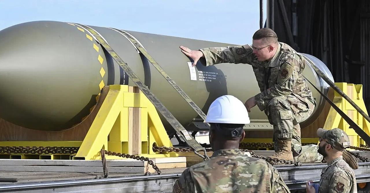 In this photo released by the U.S. Air Force on May 2, 2023, airmen look at a GBU-57, or the Massive Ordnance Penetrator bomb, at Whiteman Air Base in Missouri. (U.S. Air Force Photo)