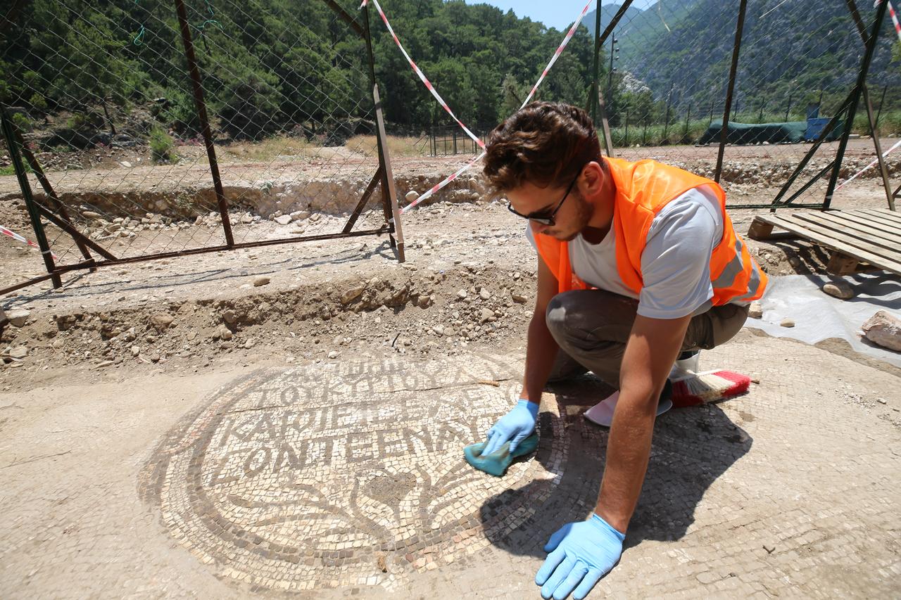 A new mosaic area and inscription have been uncovered in front of a church during excavations at the ancient city of Olympos in Kumluca, Antalya, Türkiye, June 19, 2025. (AA Photo)