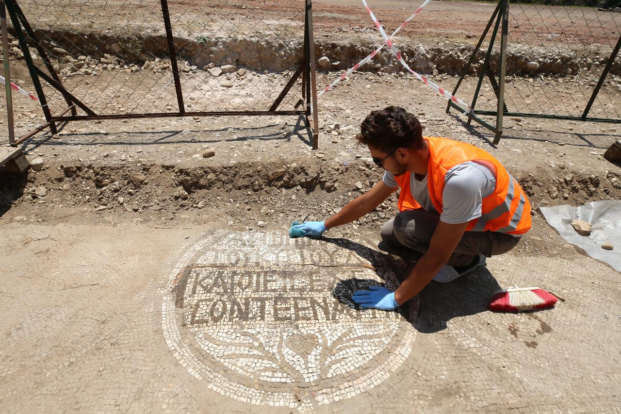 A new mosaic area and inscription have been uncovered in front of a church during excavations at the ancient city of Olympos in Kumluca, Antalya, Türkiye, June 19, 2025. (AA Photo)