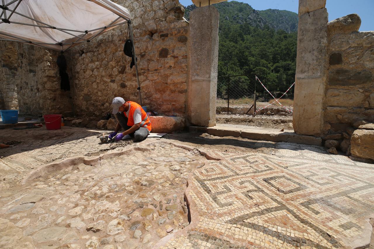 A new mosaic area and inscription have been uncovered in front of a church during excavations at the ancient city of Olympos in Kumluca, Antalya, Türkiye, June 19, 2025. (AA Photo)