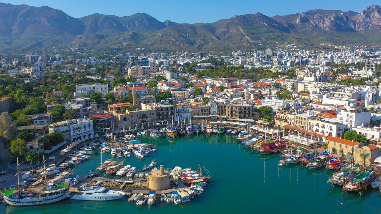 Girne, located on the northern coast of Turkish Republic of Cyprus, is famous for its historic old town with cobblestone streets and its distinctive horseshoe shaped harbor. (Adobe Stock Photo)