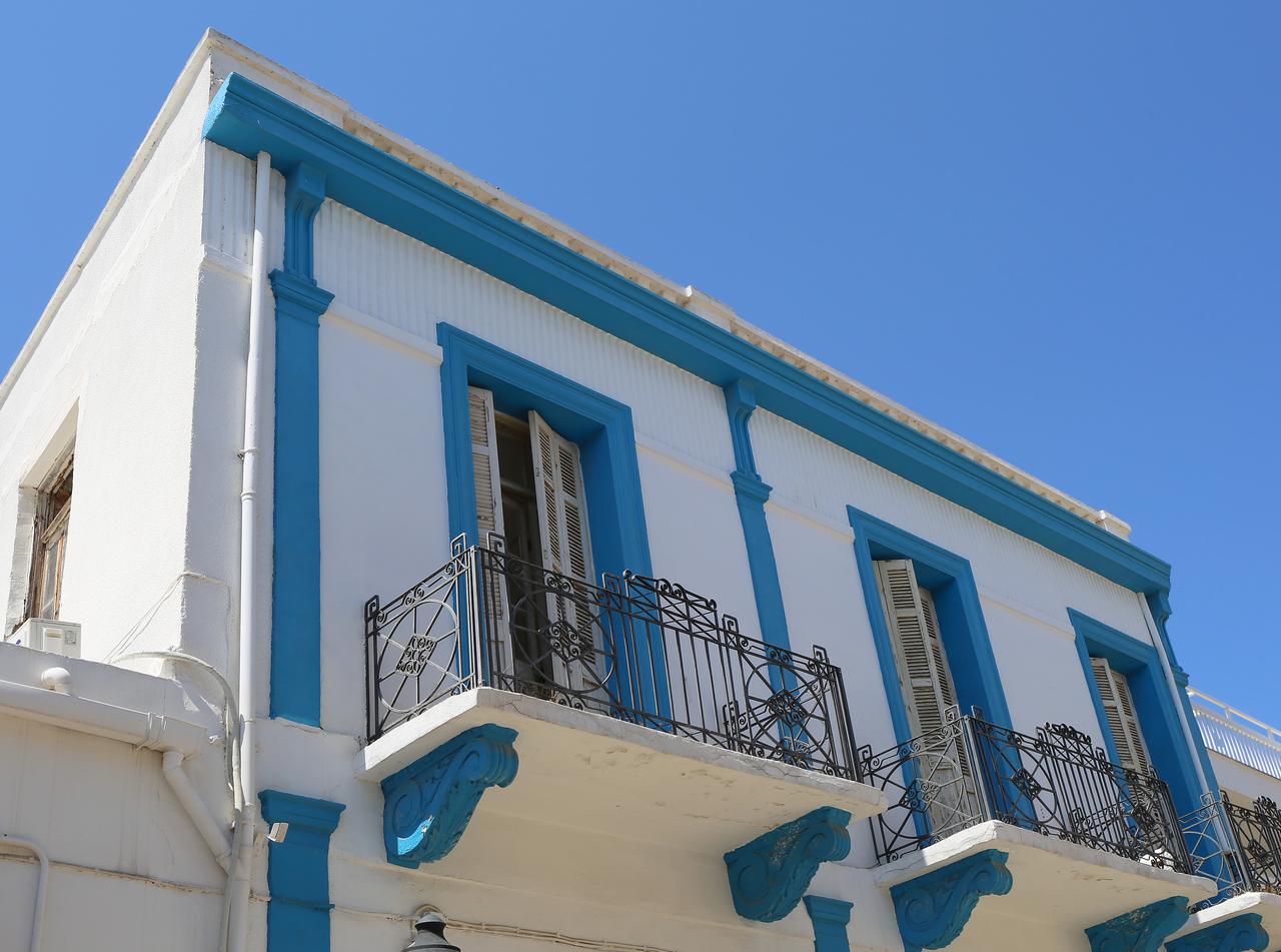 Blue and white Cypriot house with window shutters and balconies in Famagusta, Turkish Cyprus. (Adobe Stock Photo)