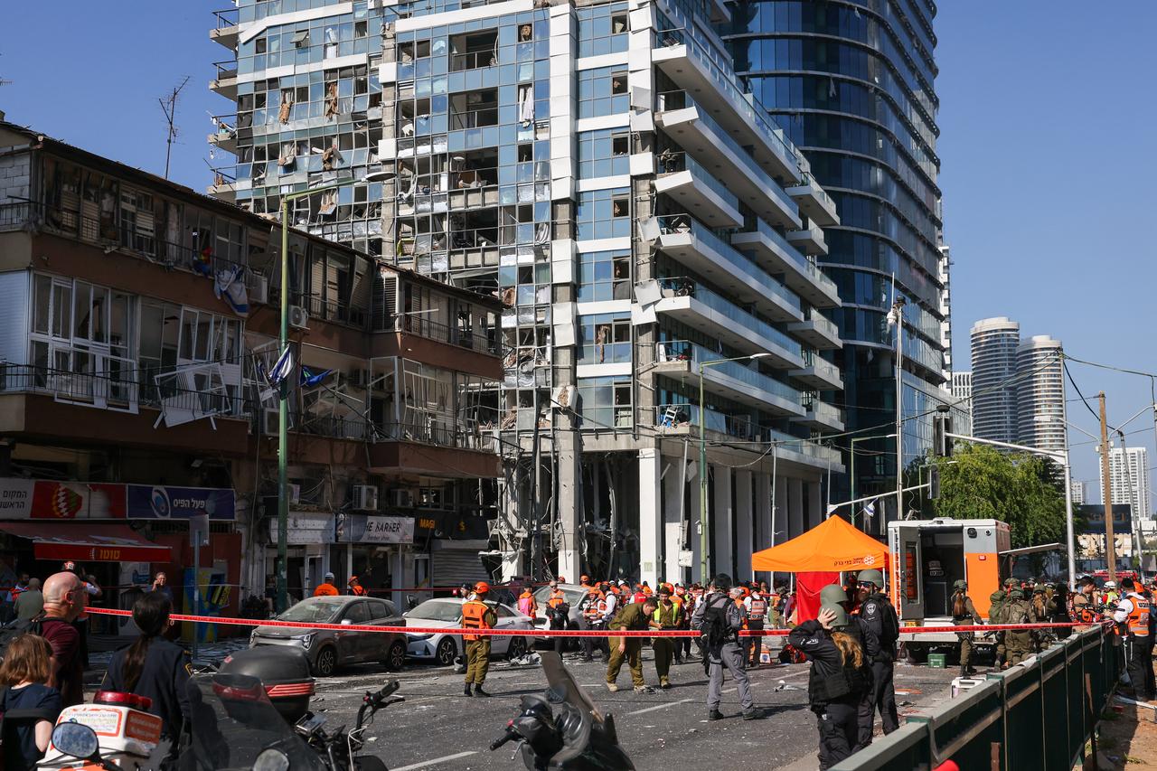 Israeli emergency services inspect the area of an Iranian missile attack in Ramat Gan in central Israel on June 19, 2025. (AA Photo)