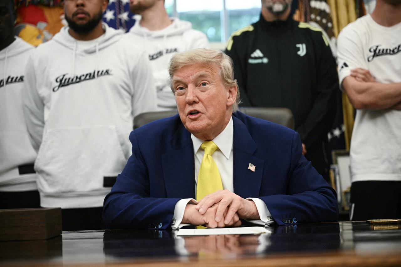 U.S. President Donald Trump speaks to the press in the Oval Office of the White House as members of Italian soccer club Juventus pay a visit in Washington, D.C., on June 18, 2025. (AFP Photo)