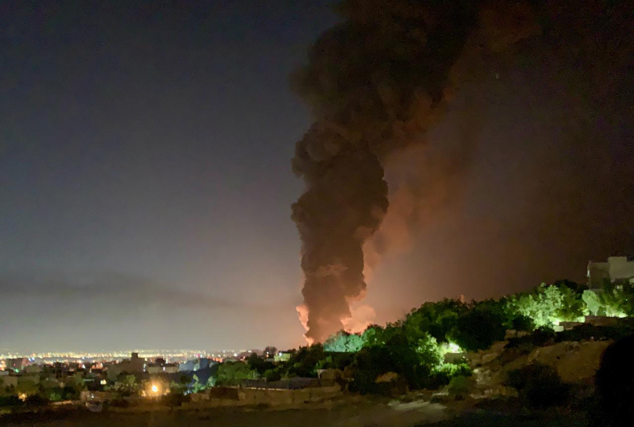 A thick plume of smoke rises into the night sky after an Israeli strike targeted a fuel depot in the Shahran district of Tehran, Iran on June 15 2025. (AA Photo)
