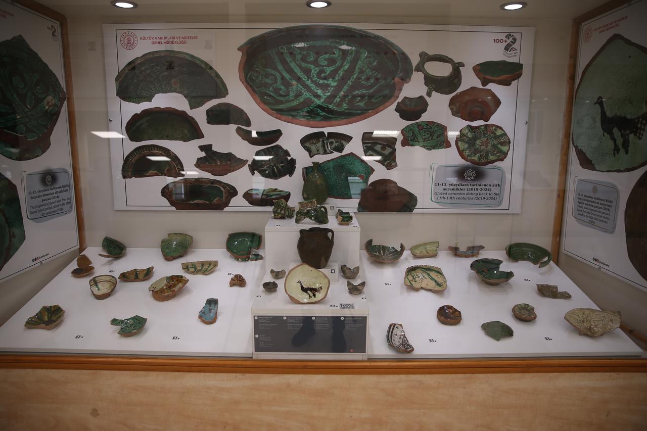 Glazed ceramics featuring various figures, unearthed during excavations at the Ani archaeological site—listed as a UNESCO World Heritage Site in Kars, Türkiye—are on display, June 18, 2025. (AA Photo)