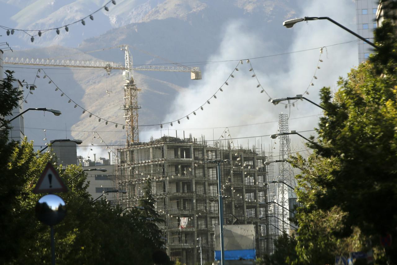 Smoke rises from an area near the Red Crescent building after an Israeli airstrike hit a location adjacent to the facility in Tehran, Iran on June 18, 2025. (AA Photo)