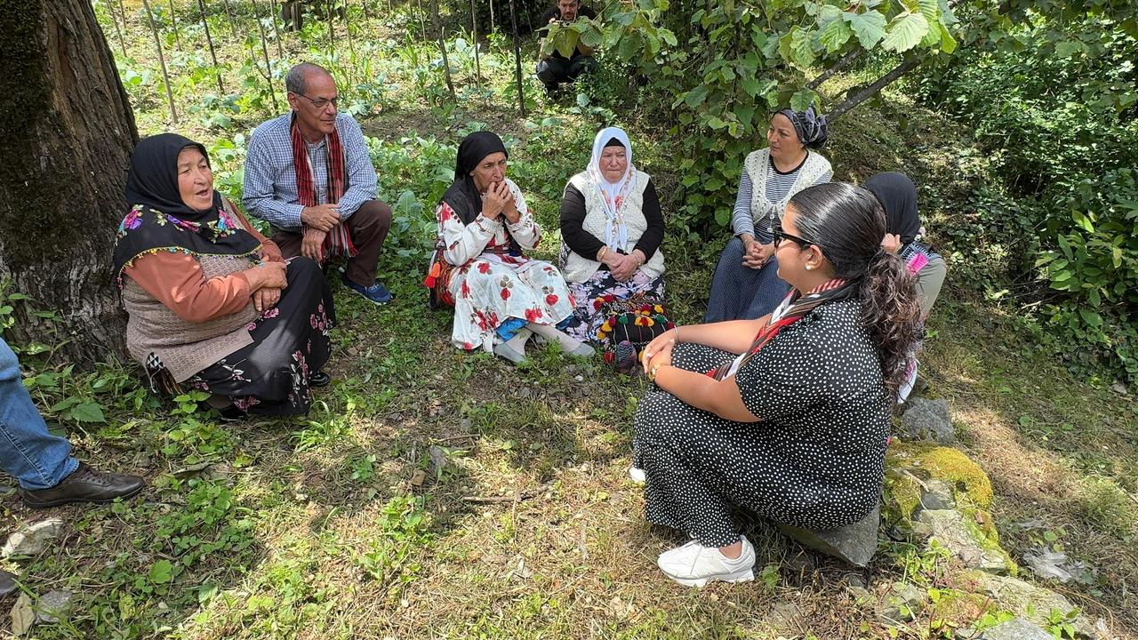 Spanish whistle language users Jose Molina Gonzalez (2L) and Carmen Castilla Padilla (R) visit Kuskoy village in Canakci district of Giresun, Türkiye, engaging in whistle language exchange with locals, Canakci, Giresun, June 18, 2025. (AA Photo)