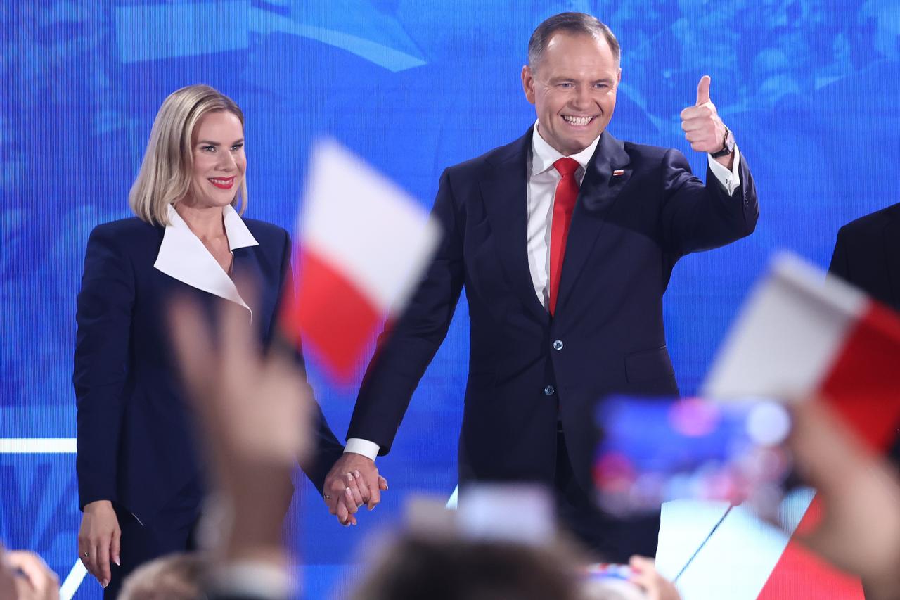 Marta Nawrocka and supported by Law and Justice party candidate for the President of Poland Karol Nawrocki during the election evening of the second round of the Presidential election in Warsaw, Poland on June 1, 2025. (AA Photo)