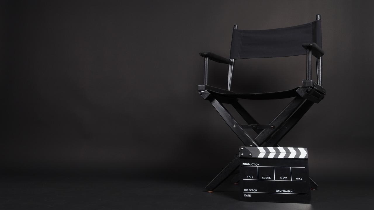 Clapper board or movie slate with director chair use in video production or movie and cinema industry. (Adobe Stock Photo)