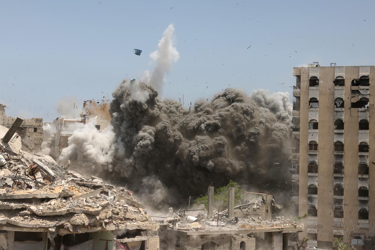 Smoke and debris rise following an Israeli strike on a house west of Jabalia, in the northern Gaza Strip, on June 1, 2025, amid the war between Israel and the Palestinian Hamas militant movement. (Photo by BASHAR TALEB / AFP)
