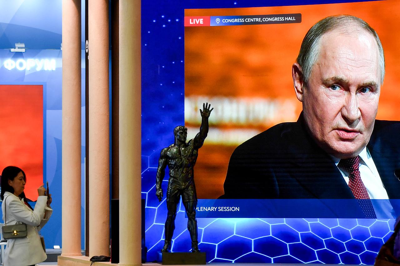 Russias President Vladimir Putin is seen on huge TV screens inside ExpoForum Convention and Exhibition Centre as he attends the plenary session during the Saint Petersburg International Economic Forum (SPIEF) in Saint Petersburg, Russia on June 20, 2025. (AFP Photo)