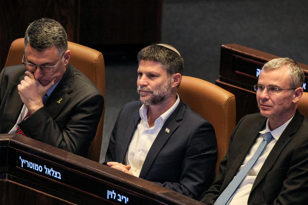 Israels (L to R) Foreign Minister Gideon Saar, Finance Minister Bezalel Smotrich, and Justice Minister Yariv Levin attend the address of Argentinas President to a session of the Israeli parliament (Knesset) at its headquarters in Jerusalem on June 11, 2025. (AFP Photo)