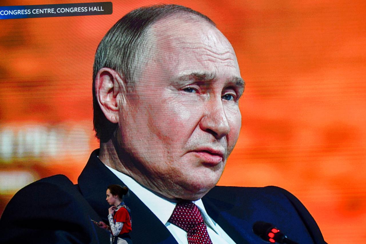 Russias President Vladimir Putin is seen on huge TV screens inside ExpoForum Convention and Exhibition Centre as he attends the plenary session during the Saint Petersburg International Economic Forum (SPIEF) in Saint Petersburg on June 20, 2025. (AFP Photo)