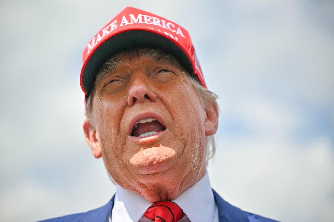 US President Donald Trump speaks to the press upon arrival at Morristown Municipal Airport in Morristown, New Jersey, on June 20, 2025. Trump is heading to his Bedminster golf resort for a MAGA Inc. fundraising dinner. (Photo by Mandel NGAN / AFP)