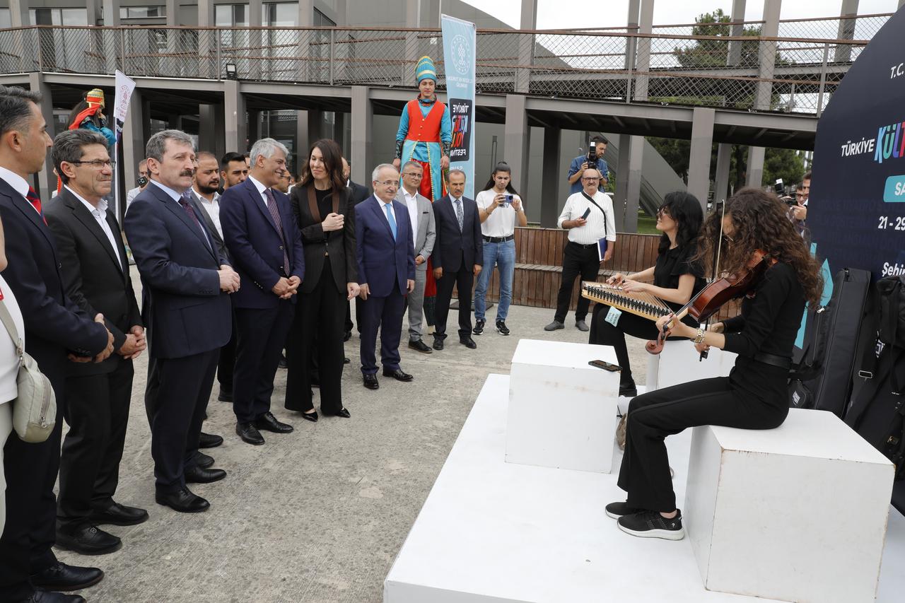Deputy Minister of Culture and Tourism Nadir Alpaslan and other officials watch a live musical performance during the opening of the Türkiye Cultural Route Festival in Samsun, Türkiye, on June 21, 2025. (AA Photo)