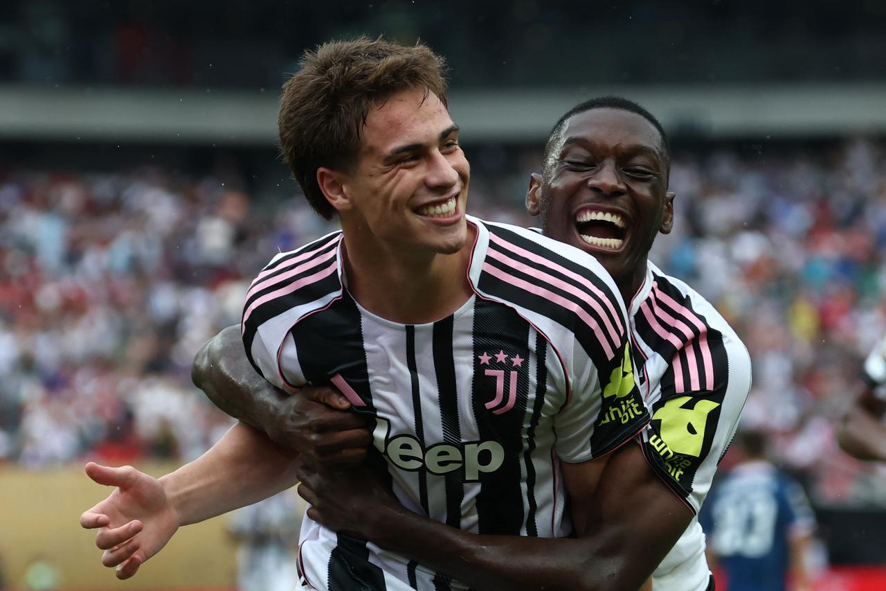 Juventus Turkish midfielder #10 Kenan Yildiz (L) is congratulated by Juventus French forward #20 Randal Kolo Muani after scoring his teams third goal during the FIFA Club World Cup 2025 Group G football match between Italys Juventus and Moroccos Wydad AC at the Lincoln Financial Field stadium in Philadelphia on June 22, 2025. (AFP Photo)