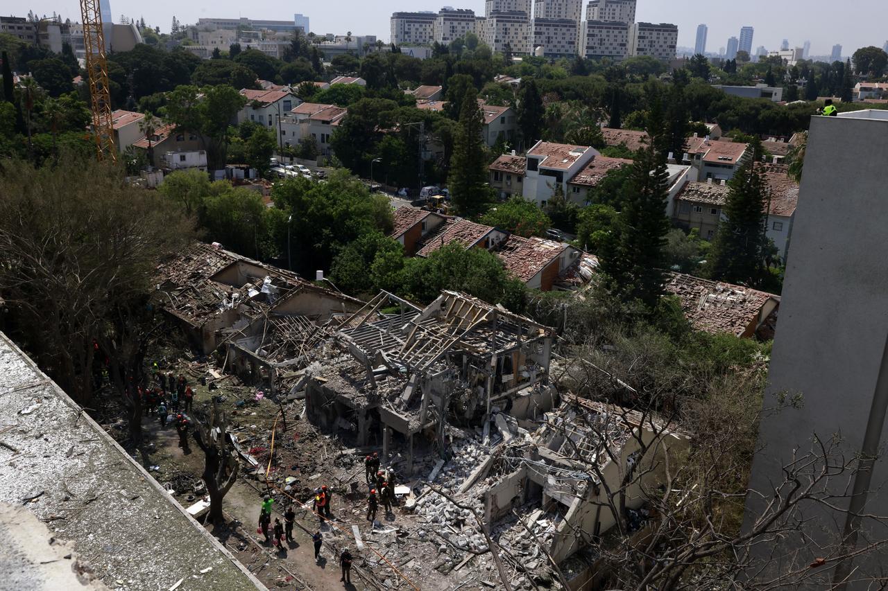 Israeli security forces and first responders gather at the site of an Iranian strike that hit a residential neighbourhood in the Ramat Aviv area in Tel Aviv on June 22, 2025. (AFP Photo)