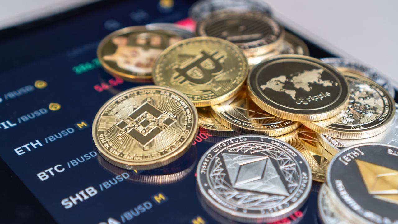 Bitcoin (BTC) cryptocurrency token alongside Ethereum (ETH) and other altcoins representing blockchain, DeFi, and decentralized fintech trading markets.. (Adobe Stock Photo)