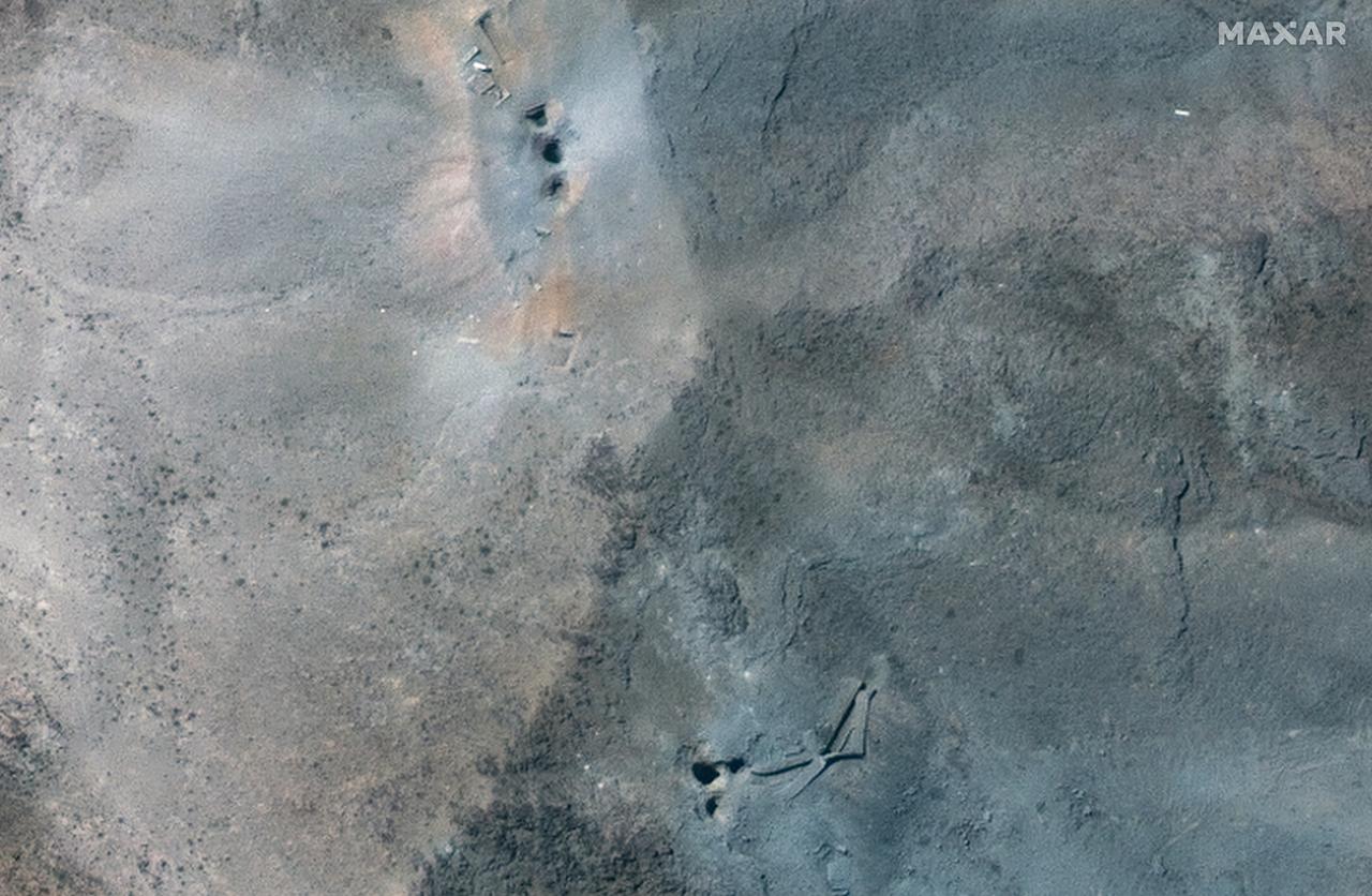 This handout satellite picture provided by Maxar Technologies and taken on June 22, 2025, shows a close-up view of craters after US strikes on Irans Fordow Fuel Enrichment Plant (FFEP), northeast of the city of Qom. (Photo by Satellite image ©2025 Maxar Technologies / AFP)