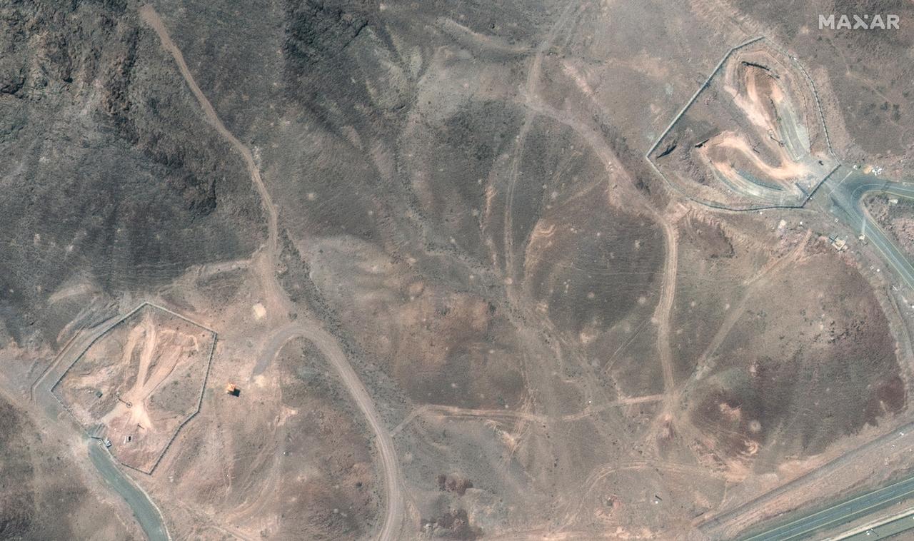 This handout satellite picture provided by Maxar Technologies and taken on June 22, 2025, shows a view of tunnel entrances after US strikes on Irans Fordow Fuel Enrichment Plant (FFEP), northeast of the city of Qom. (Photo by Satellite image ©2025 Maxar Technologies / AFP)