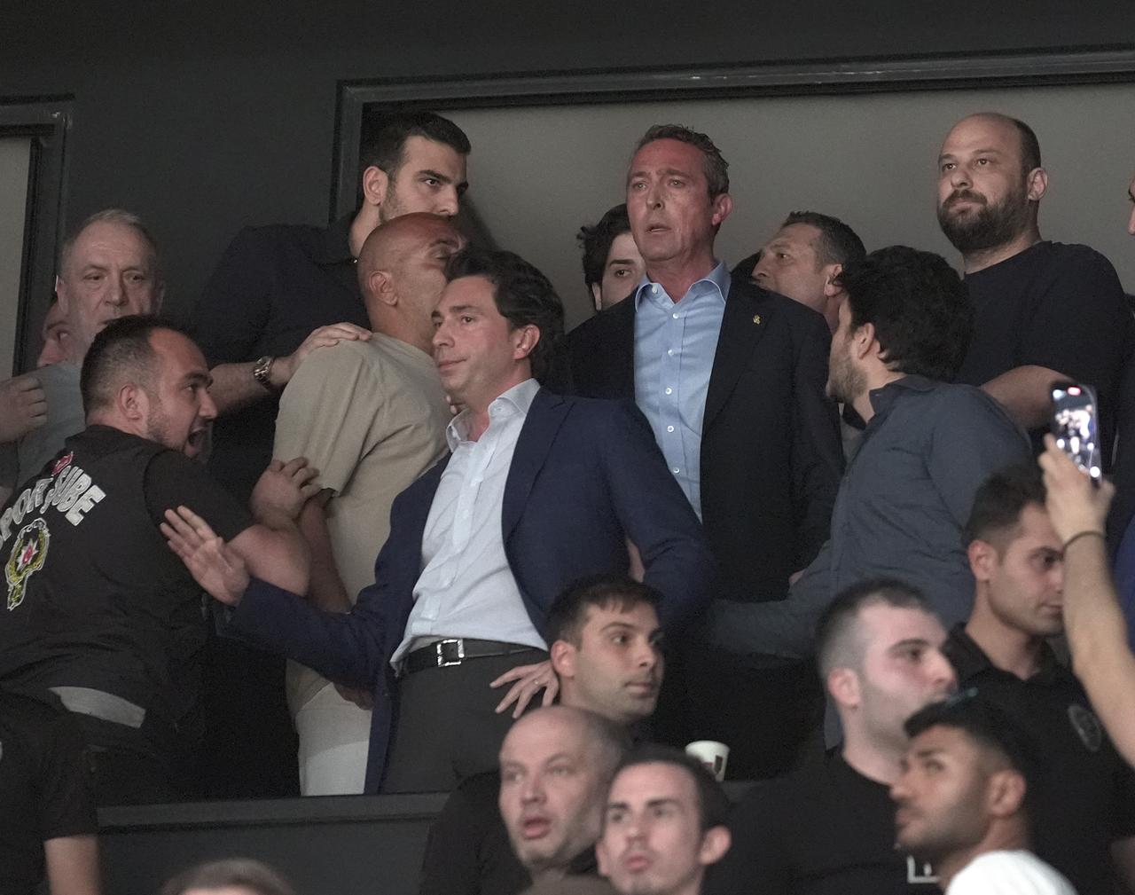 Tensions flare in the final moments of the derby as Fenerbahce President Ali Koc (center) approaches the executive box after black-and-white fans hurl obscenities, during Game 4 of the Türkiye Sigorta Basketball Super League playoff finals between Fenerbahce Beko and Besiktas Fibabanka at Basketball Development Center, Istanbul, Türkiye on June 23, 2025. (AA Photo)