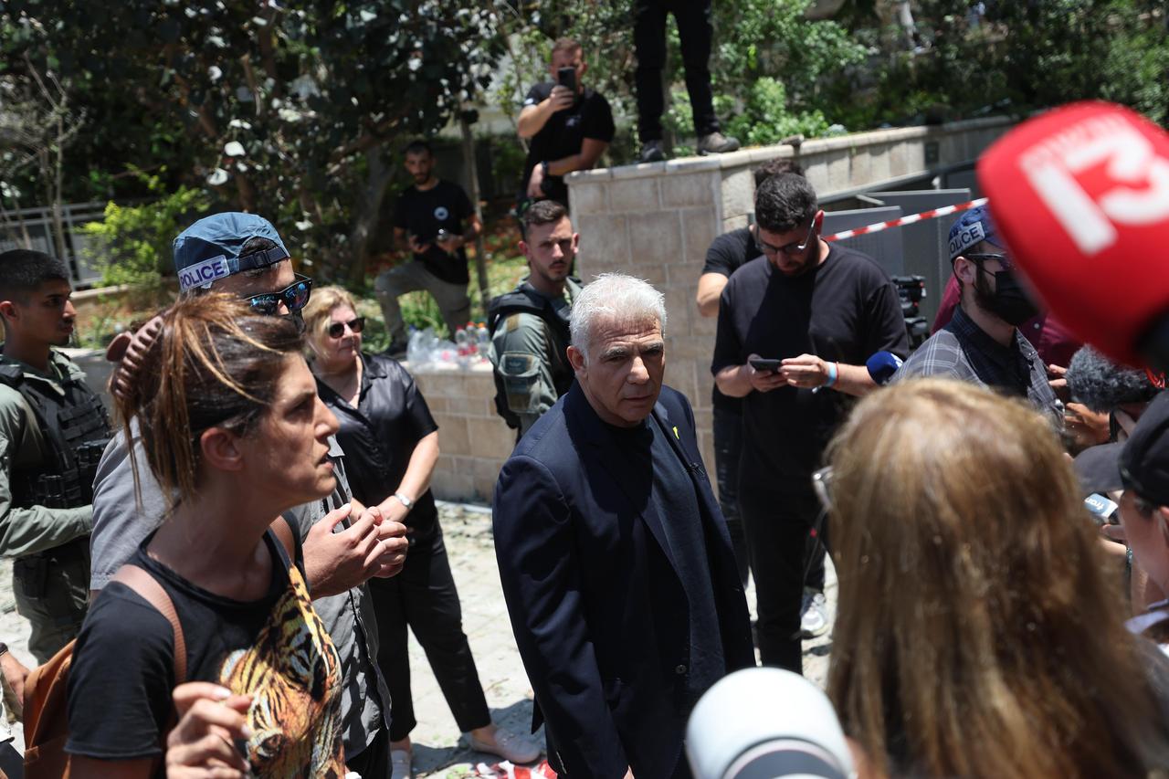 Yair Lapid, Israels opposition leader, holds a press conference after one of the missiles, launched by Iran in retaliation for Israeli attacks, hits Ness Ziona, Israel on June 22, 2025. (AA Photo)