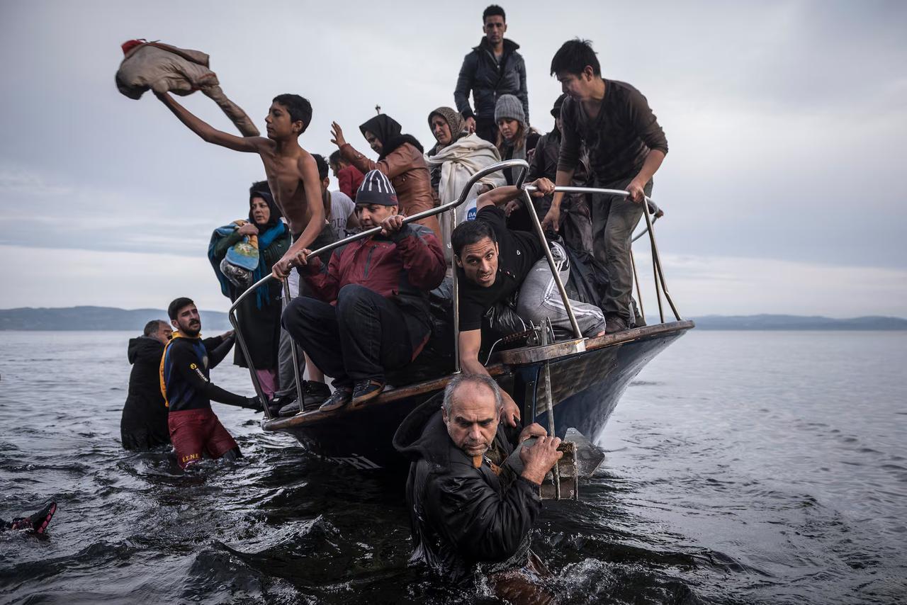 Refugees arrive to the Greek island of Lesbos after crossing the Aegean sea in October 2015, captured by Pulitzer Prize-winning photographer Sergey Ponomarev, now exhibited in Rotterdams Fenix Museum of Migration, Netherlands, May 14, 2025. (Photo by Selin Hacialioglu/Türkiye Today) 