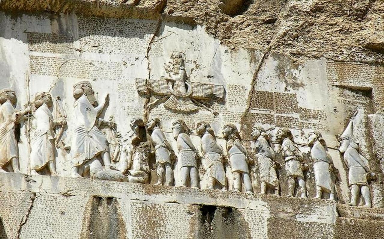 Darius’ Behistun Inscription, the king of kings, the largest figure in the frieze, shown with Gaumata under his boot. (Photo via wunderkammertales.blogspot.com)