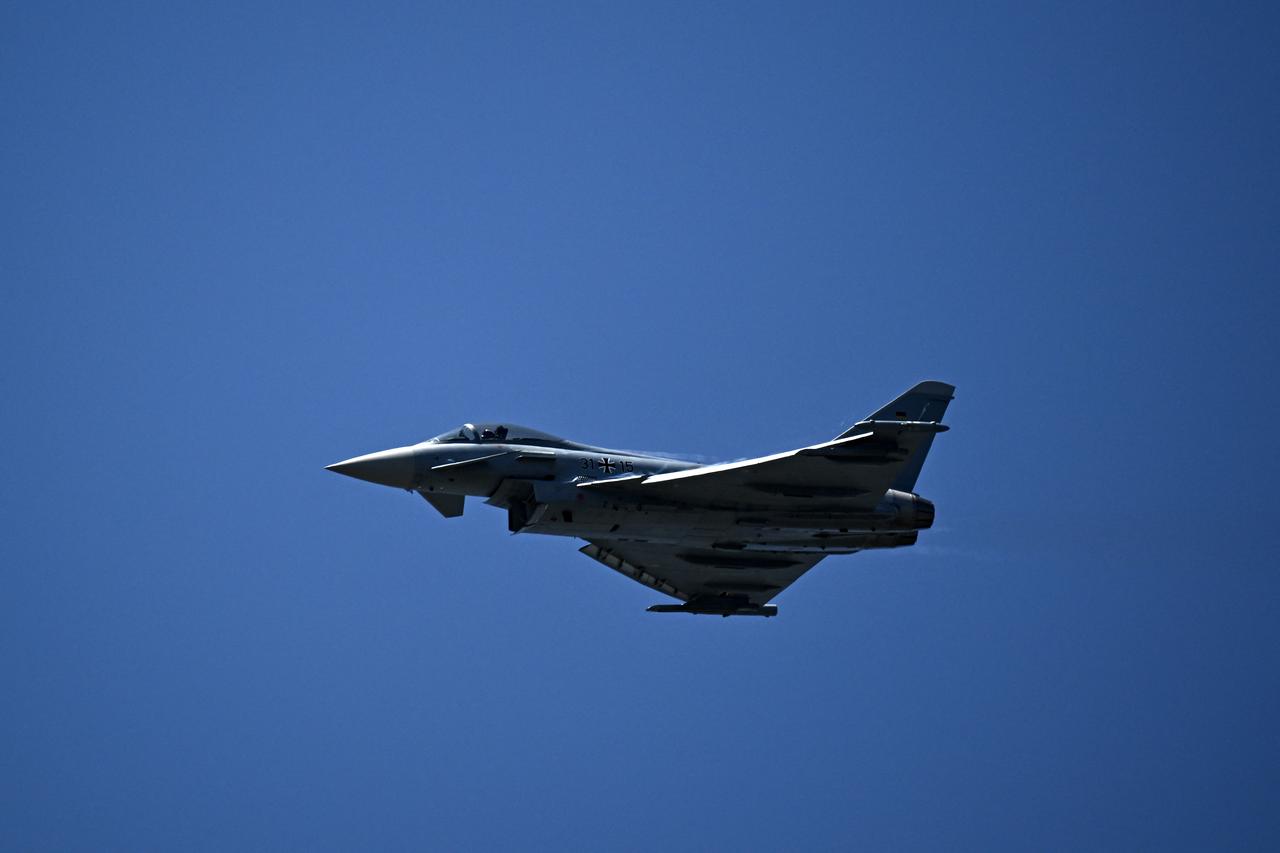 A German Eurofighter Typhoon jet performs during an exhibition flight demonstration as part of the 55th edition of the International Paris Air Show (Salon international de laeronautique et de lespace - SIAE) at the Paris–Le Bourget Airport, in Le Bourget, north of Paris on June 18, 2025. (AFP Photo)