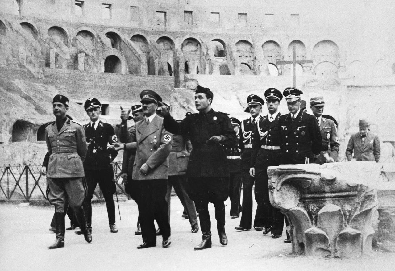 A photograph of Adolf Hitler while walking inside the Coliseum, Rome, Italy, May 1938. (Photo via War-Documentary)