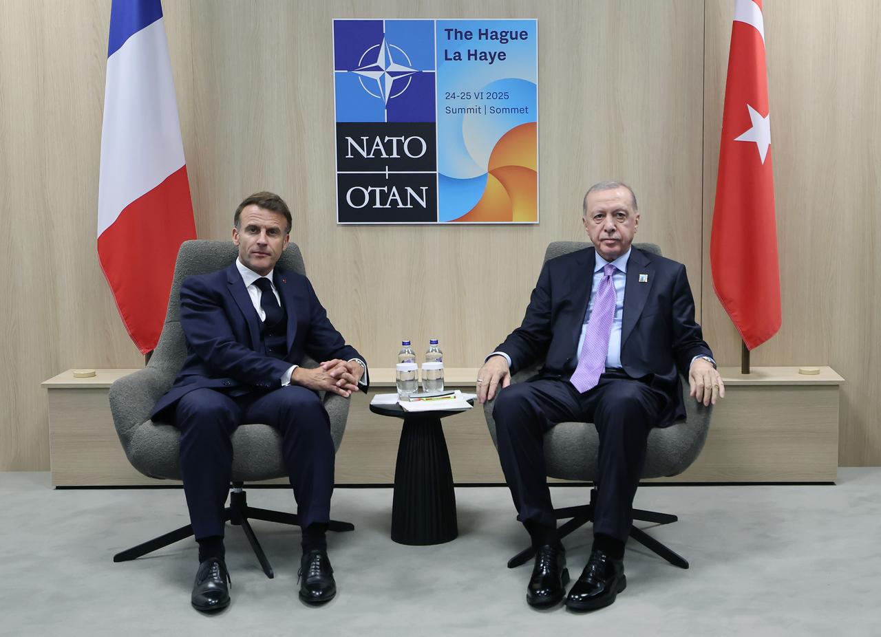 President Recep Tayyip Erdogan (R) meets with French President Emmanuel Macron (L) within the NATO Heads of State and Government Summit in The Hague, Netherlands on June 25, 2025. (TUR Presidency /Murat Cetinmuhurdar - Anadolu Agency)
