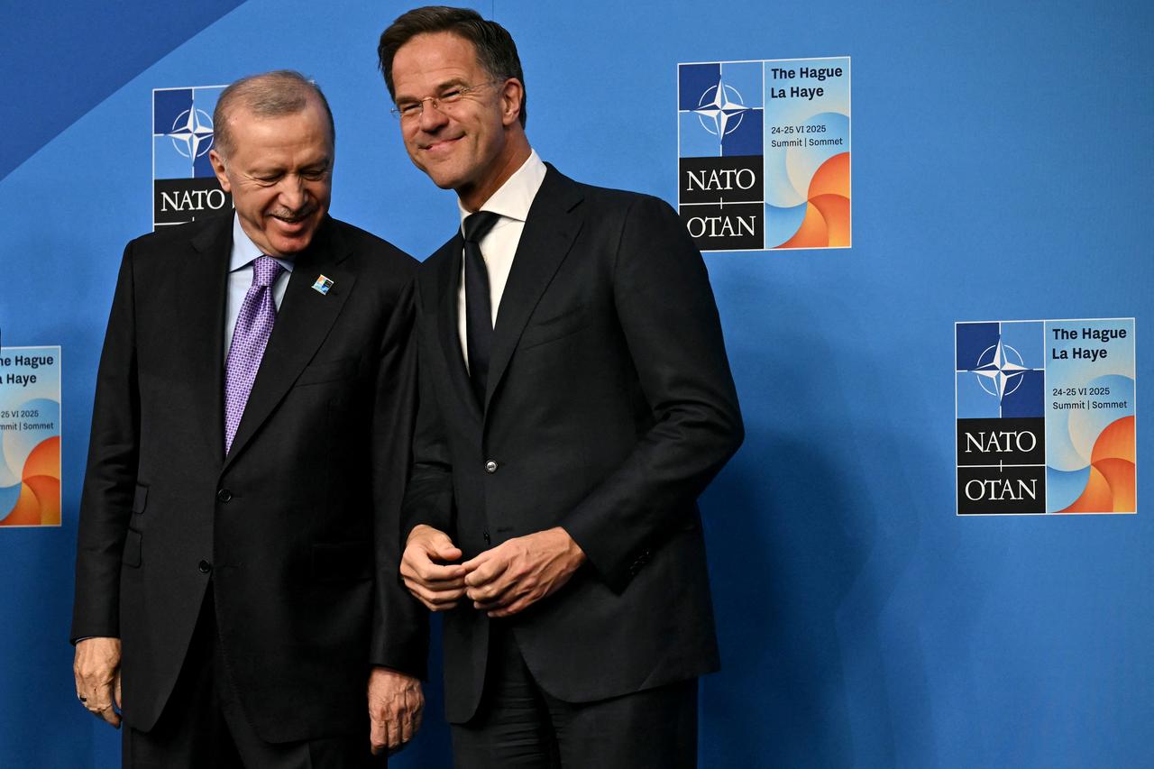 President Recep Tayyip Erdogan poses for a picture with NATO Secretary General Mark Rutte during the North Atlantic Treaty Organization (NATO) Heads of State and Government summit in The Hague, on June 25, 2025. (AFP Photo)