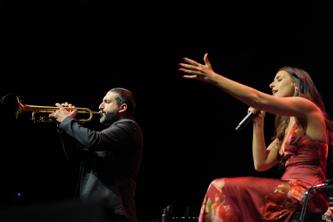 World-renowned instrumentalist Ibrahim Maalouf (left) and his singer and actress wife Hiba Tawaji (right) performed a concert accompanied by a symphony orchestra at the Harbiye Cemil Topuzlu Open-Air Theatre, Istanbul, Türkiye, June 24, 2025. (AA Photo)