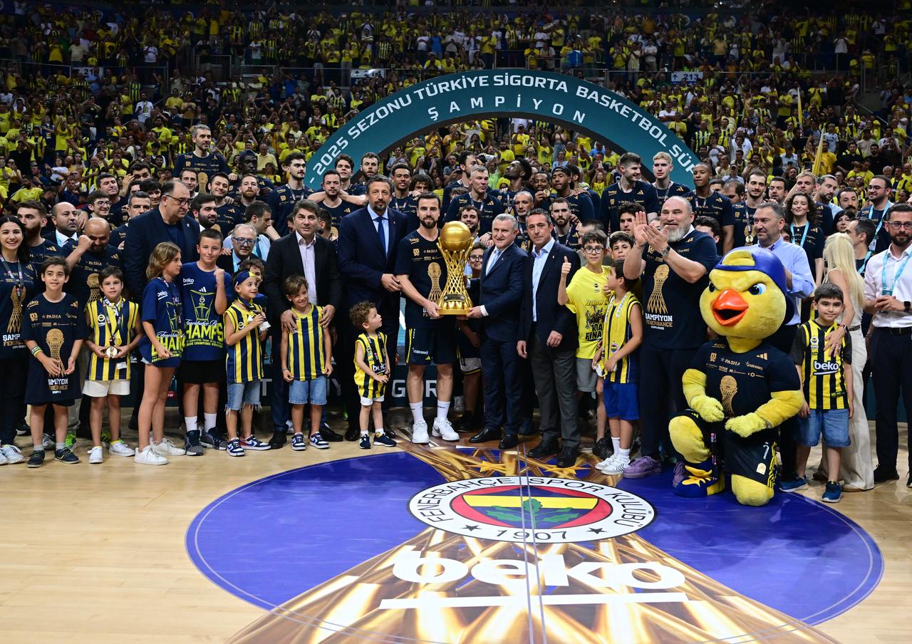 Players and head coach of Fenerbahce Beko celebrate as they win the Basketball Super League after beating Besiktas Fibabanka on the play-off final series at Ulker Sports Arena in Istanbul, Turkiye on June 25, 2025. (AA Photo)