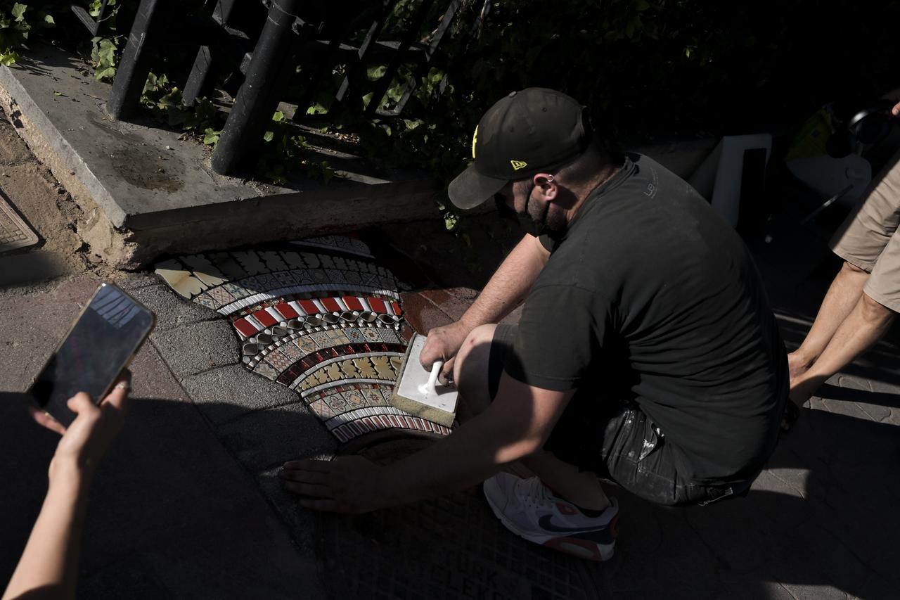 Famed French anonymous street artist Ememem created a mosaic installation on a sidewalk along Paris Street, where the French Embassy in Ankara is located, Türkiye, June 25, 2025. (AA Photo)